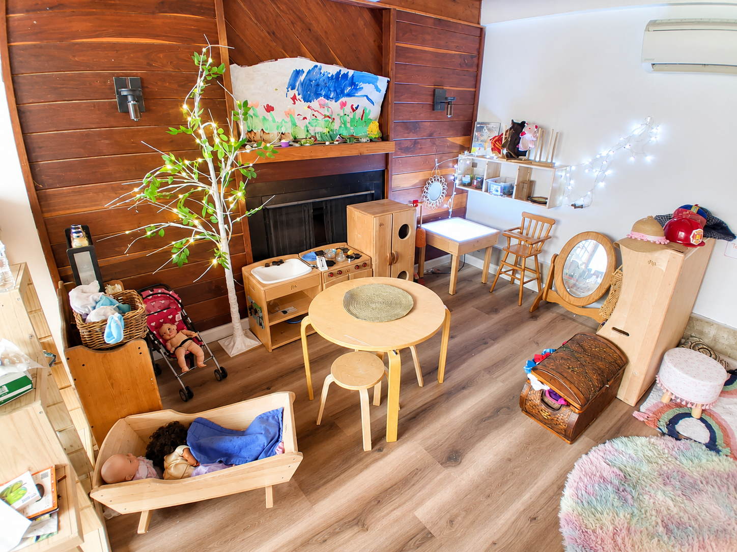 Orem childcare classroom with wooden furniture and play areas